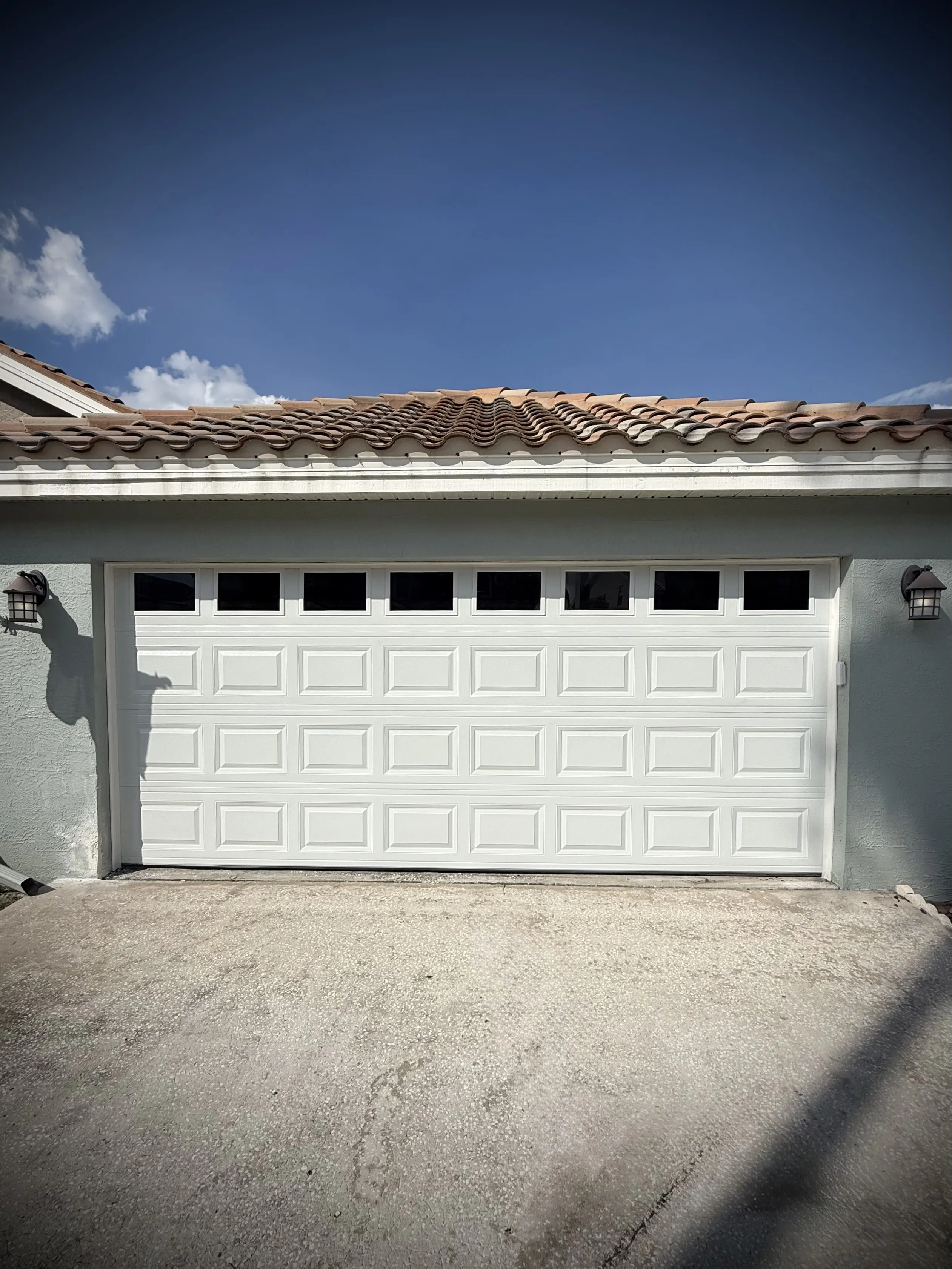 Project CHI Model 2250 Garage Door Installation with Short Raised Panels and Windows image